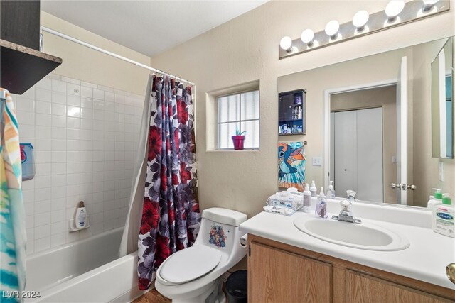 full bathroom featuring vanity, toilet, and shower / tub combo with curtain