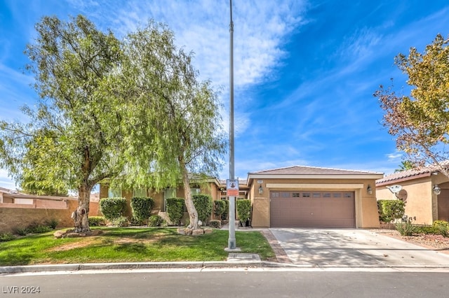 10909 Bramante Dr, Las Vegas, NV 89141 - view of front of house with a front lawn, driveway, stucco siding, and an attached garage