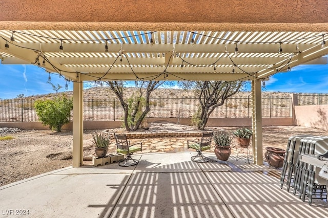 view of patio with fence and a pergola