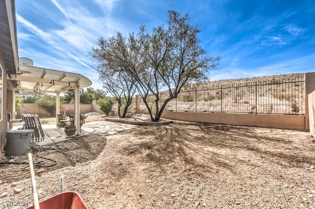 view of yard with a fenced backyard and a patio