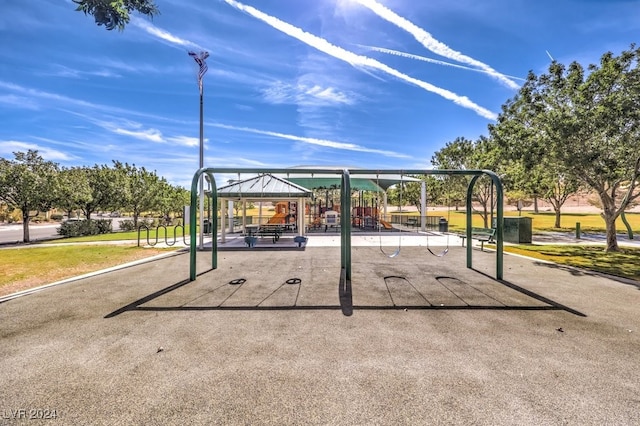 view of home's community featuring a lawn, playground community, and a gazebo