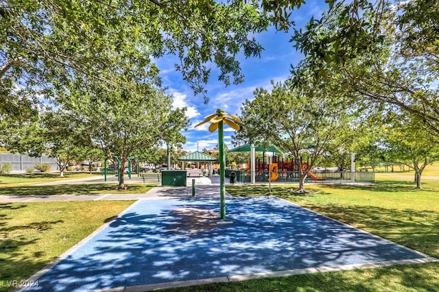 view of home's community featuring playground community, a yard, a gazebo, and fence