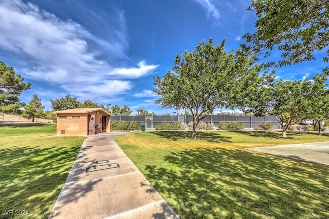 surrounding community featuring a yard and fence