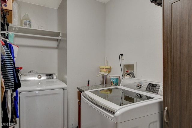 clothes washing area featuring washing machine and clothes dryer