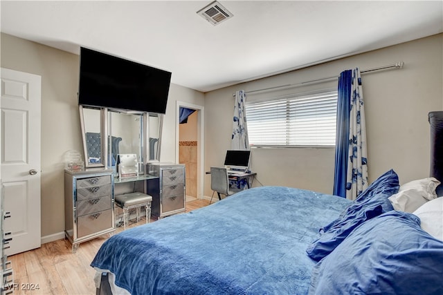 bedroom with light wood-type flooring