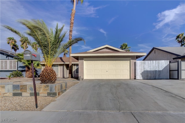 single story home featuring a garage