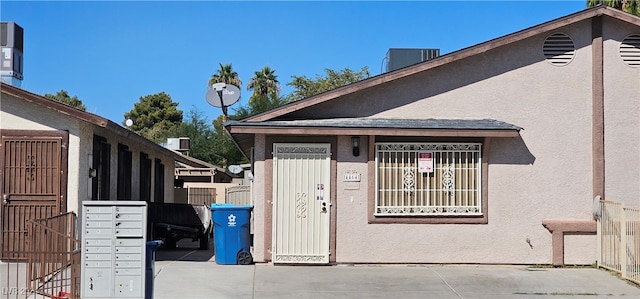 view of property exterior featuring a mail area