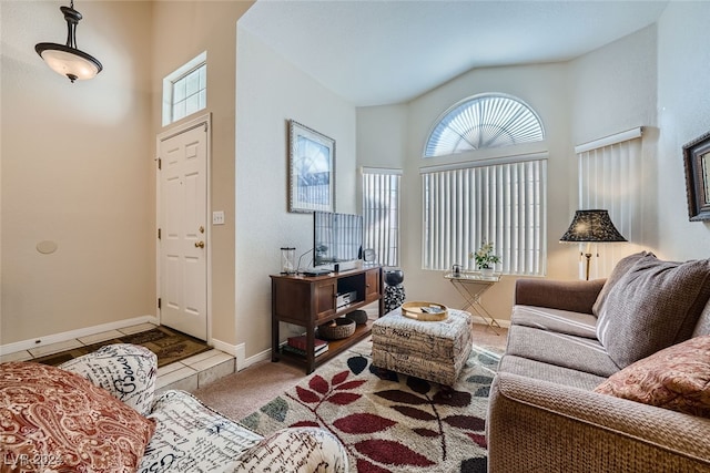 living room featuring a wealth of natural light and vaulted ceiling