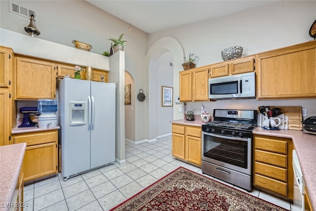 kitchen with stainless steel appliances and light tile patterned floors