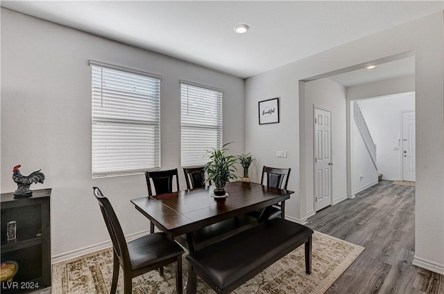 dining area featuring wood finished floors and baseboards