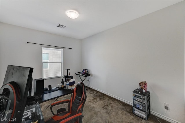 office area featuring carpet floors, visible vents, and baseboards