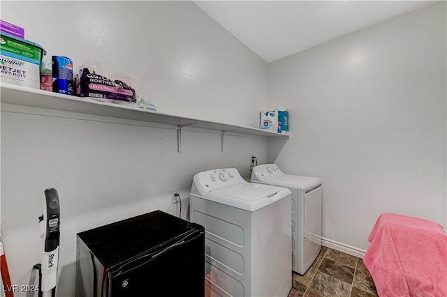 laundry area featuring laundry area, separate washer and dryer, and baseboards