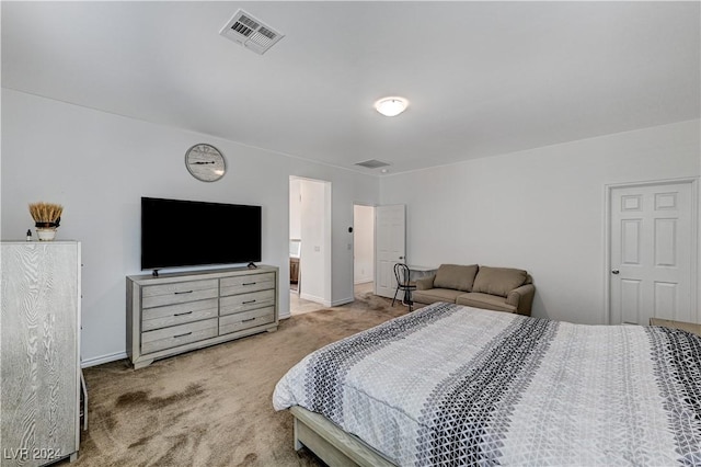 carpeted bedroom with baseboards and visible vents