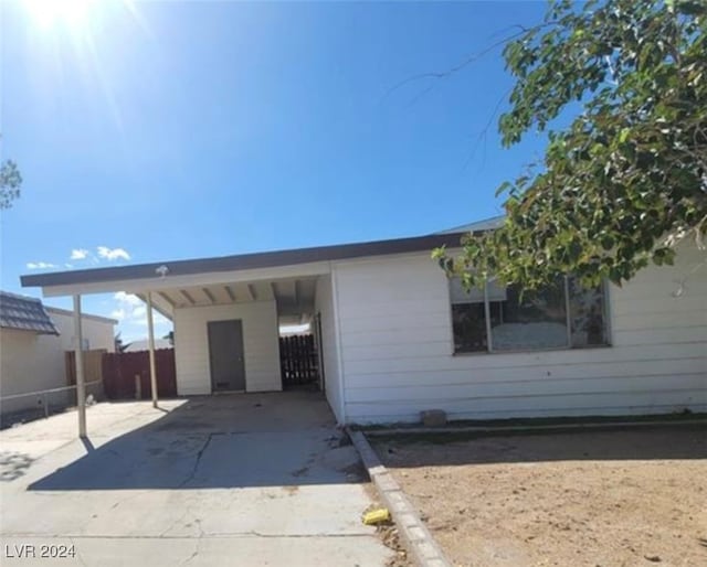 exterior space with a carport