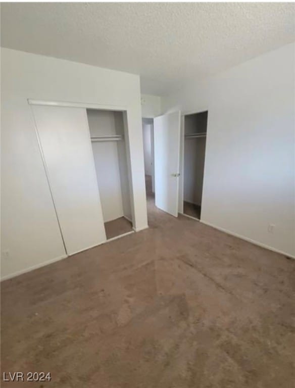 unfurnished bedroom featuring a textured ceiling