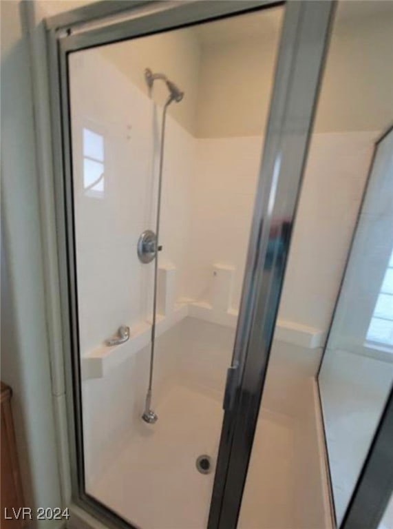 bathroom featuring walk in shower