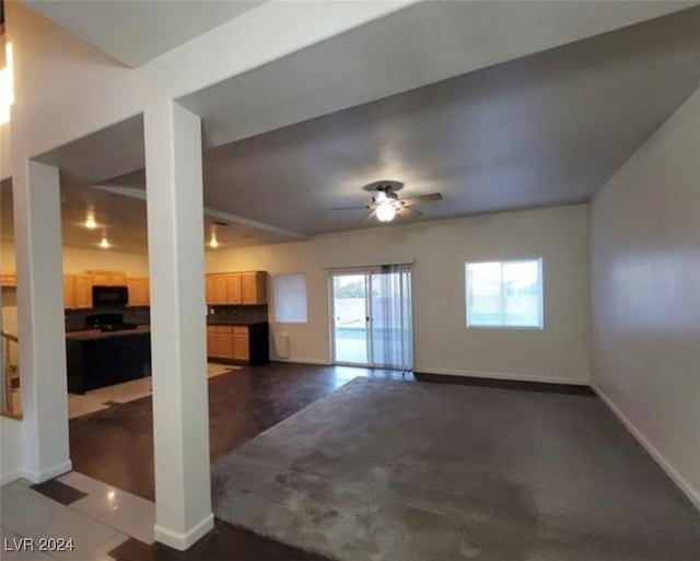 unfurnished living room with ceiling fan