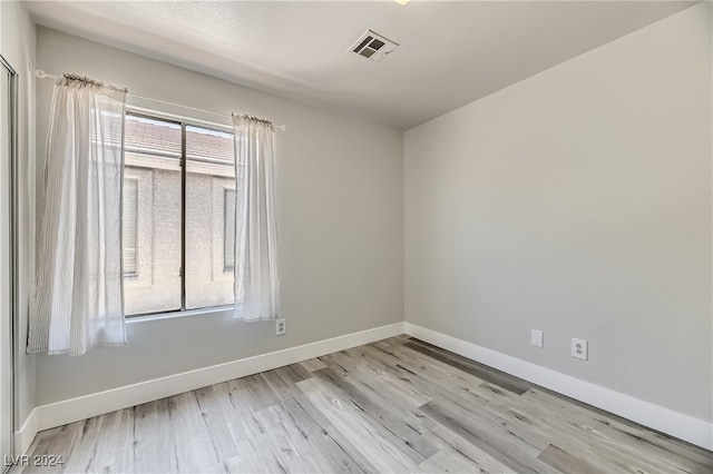 unfurnished room featuring light hardwood / wood-style flooring