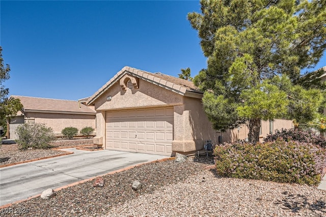 ranch-style home with a garage