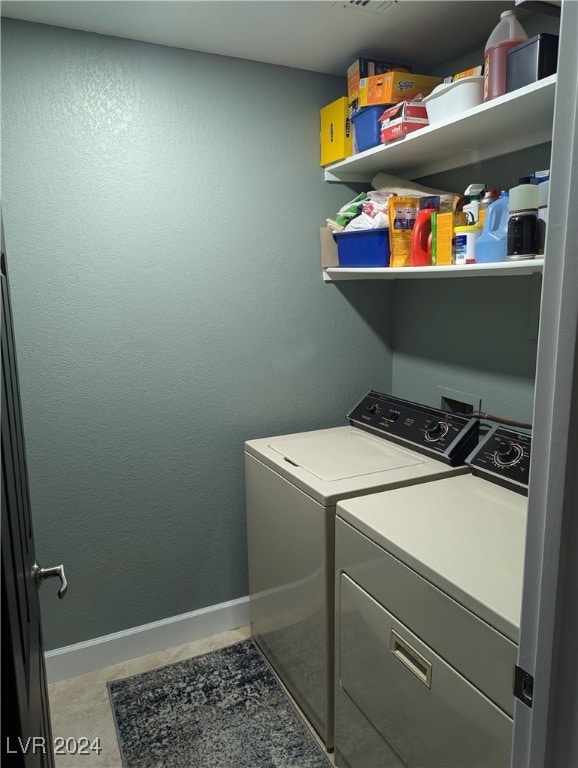 clothes washing area featuring washing machine and clothes dryer