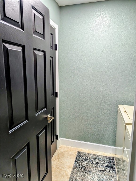 bathroom with tile patterned floors