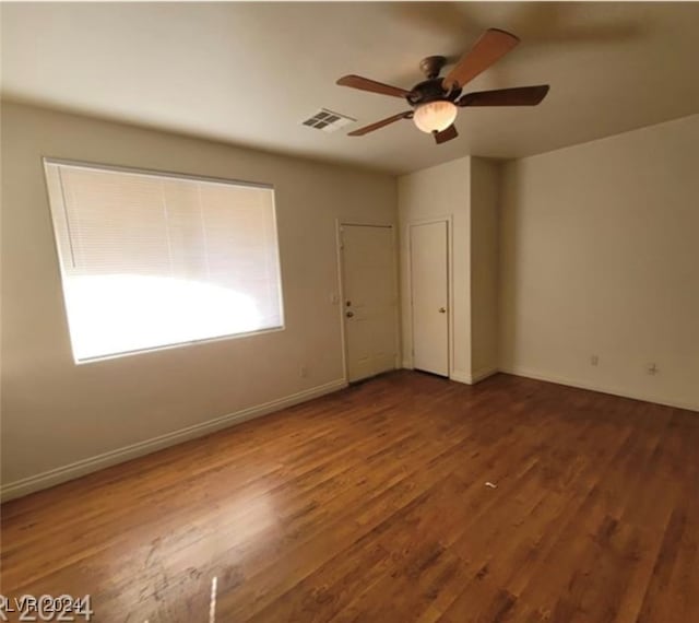 spare room featuring hardwood / wood-style flooring and ceiling fan