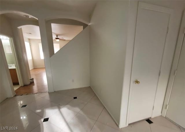 corridor with light tile patterned floors