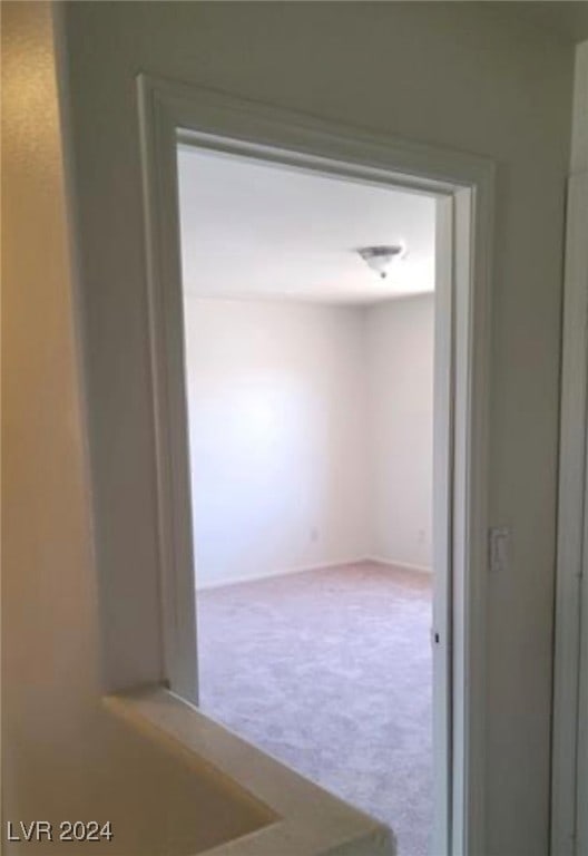 corridor with carpet floors