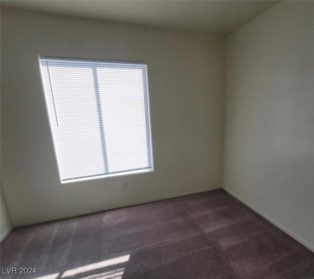 carpeted spare room with a healthy amount of sunlight