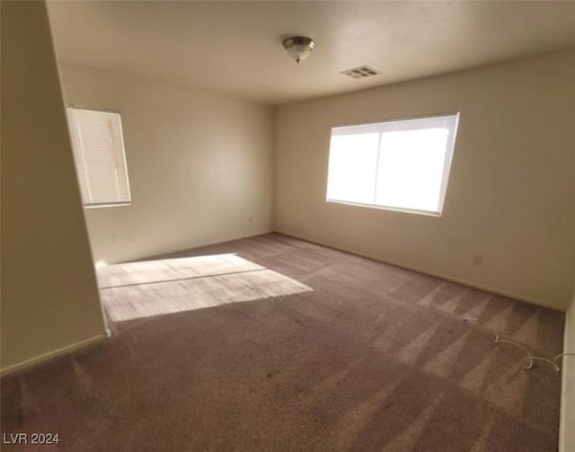 empty room featuring carpet flooring