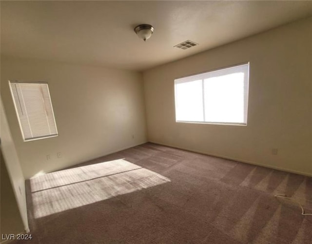 unfurnished room with carpet floors