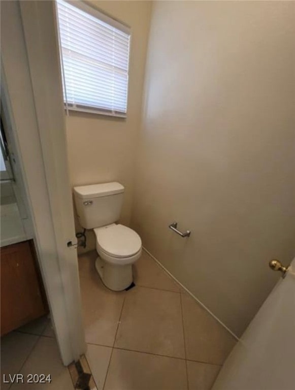 bathroom featuring tile patterned flooring and toilet