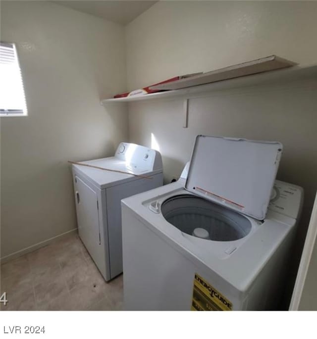 clothes washing area with washer and dryer