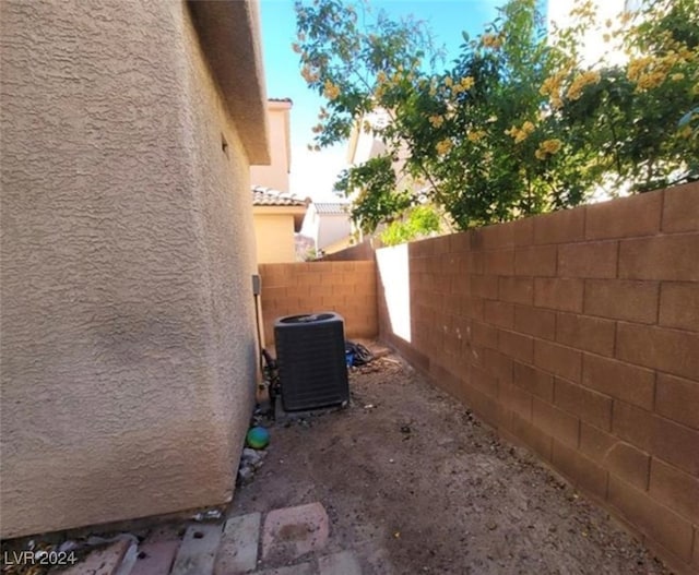 view of side of home featuring central AC