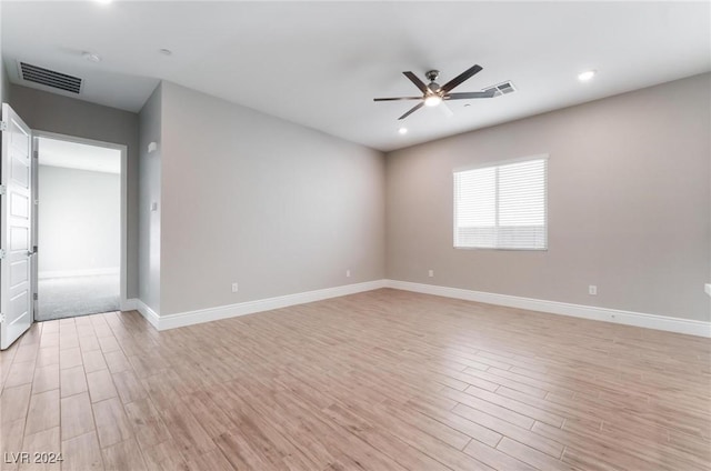 unfurnished room featuring ceiling fan and light wood-type flooring