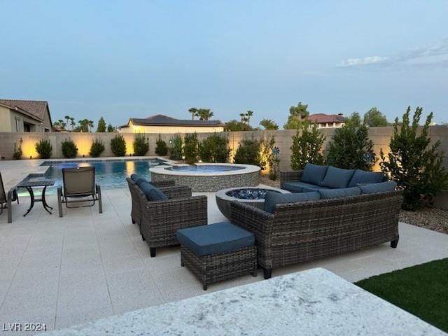 view of patio with outdoor lounge area and a pool with hot tub