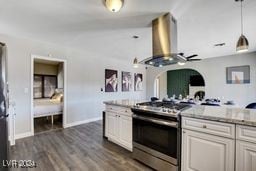 kitchen featuring dark wood-type flooring, pendant lighting, stainless steel range, and exhaust hood