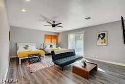 bedroom with ceiling fan and hardwood / wood-style floors