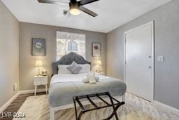 bedroom with ceiling fan and hardwood / wood-style floors