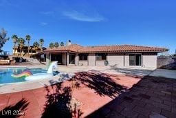 rear view of property with a patio area