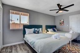 bedroom featuring ceiling fan and hardwood / wood-style flooring