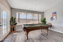 rec room featuring wood-type flooring, billiards, and a wealth of natural light