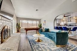 living room featuring hardwood / wood-style flooring and pool table