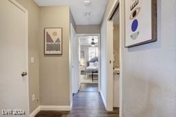 corridor featuring dark wood-type flooring