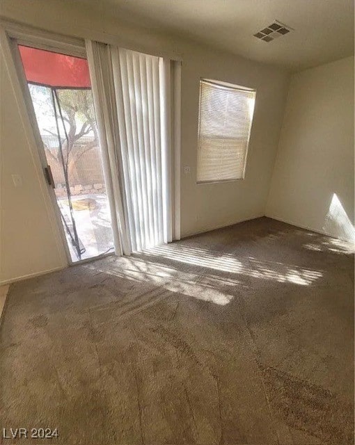 unfurnished room with carpet floors