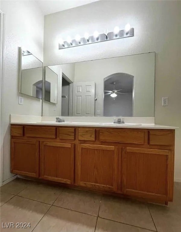 bathroom with ceiling fan, tile patterned flooring, and vanity