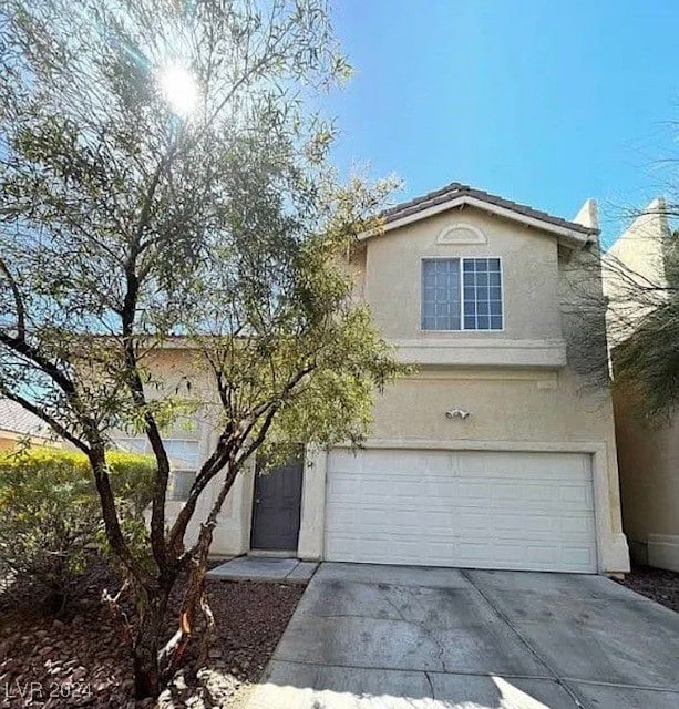 view of property featuring a garage