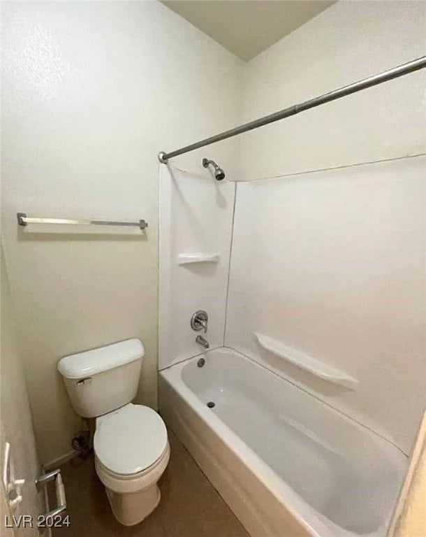 bathroom with shower / bath combination and toilet