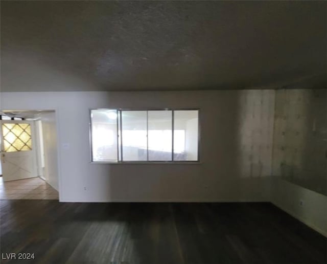 unfurnished room featuring wood-type flooring