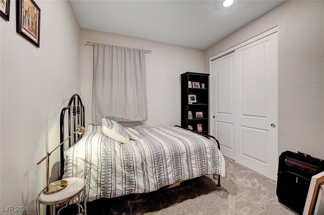 carpeted bedroom with a closet